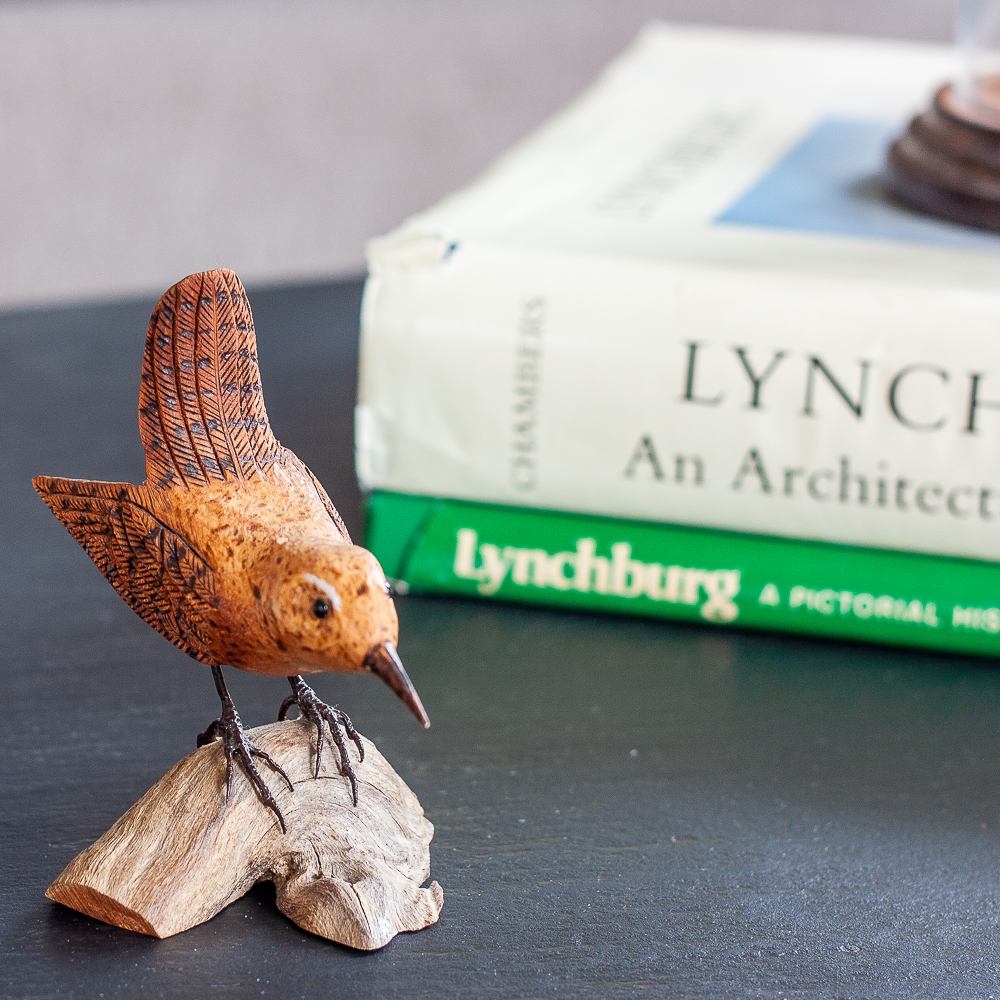 Hand carved bird displayed with S. Allen Chambers Lynchburg an Architectural History book and Lynchburg, A Pictorial History Book