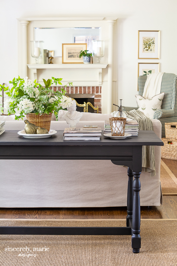 Black console table decorated for spring