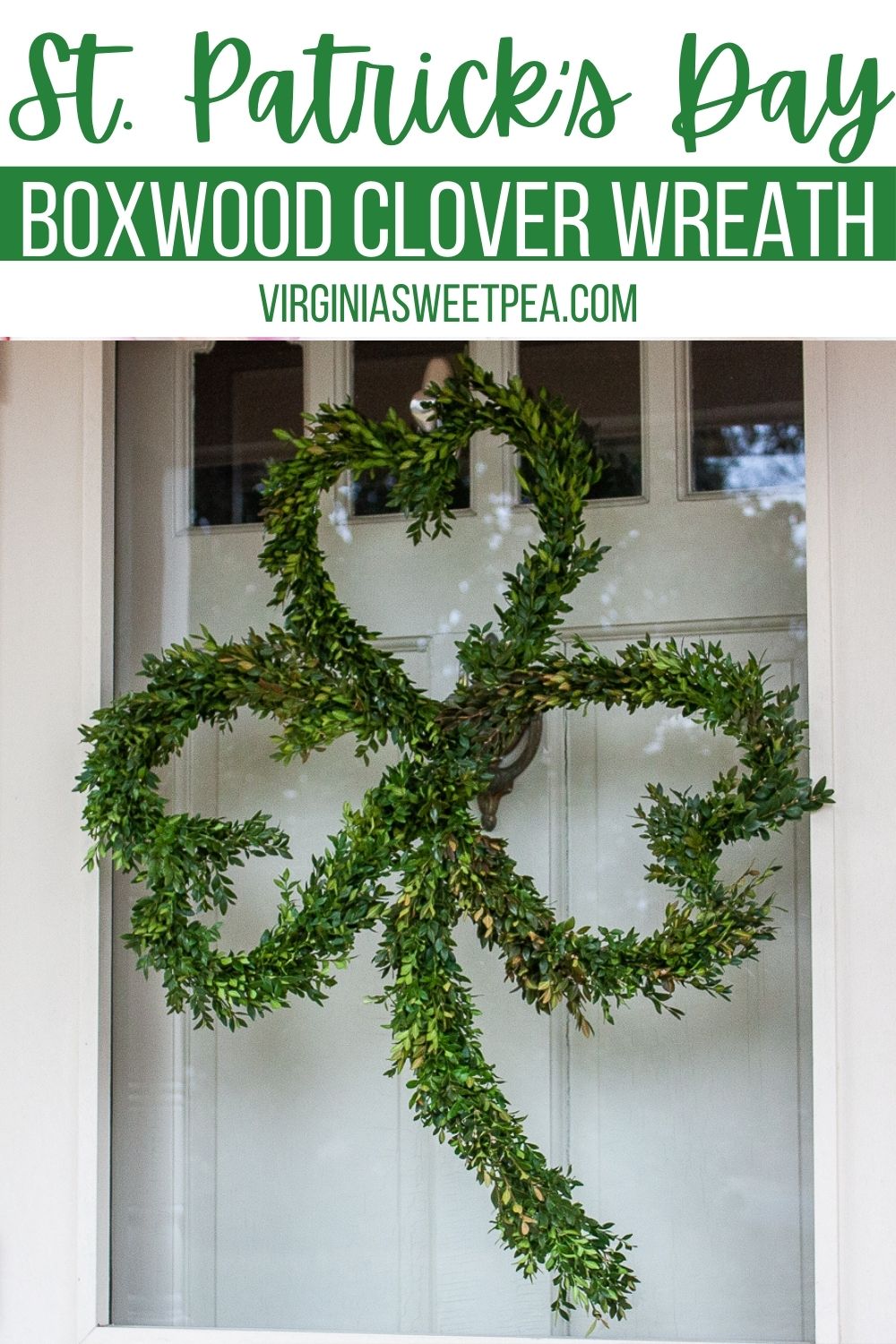 Wreath shaped like a clover with Boxwood attached to it