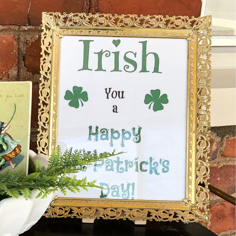 St. Patrick's Day free printable in a gold filigree frame that says Irish you a Happy St. Patrick's Day