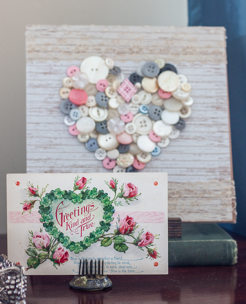 Early 1900s Valentine's Day postcard with a heart made with vintage buttons