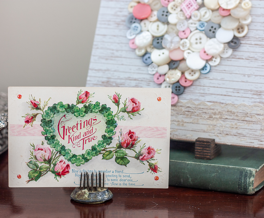 Early 1900s Valentine's Day postcard with a heart made with vintage buttons