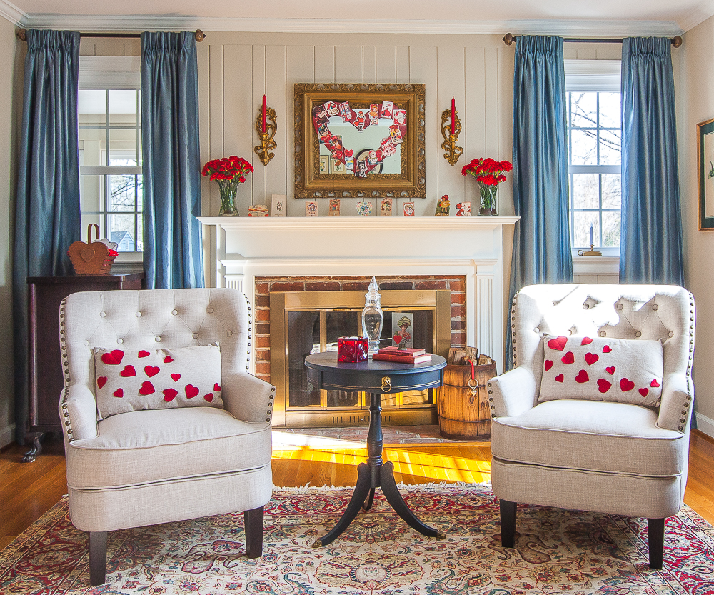 Living room decorated with vintage Valentine's Day decor pieces including the mantel