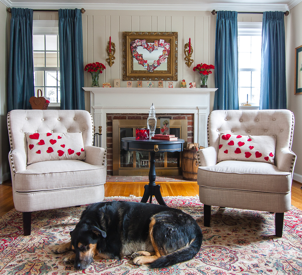 Dog on a rug in a living room decorated for Valentine's Day with Vintage