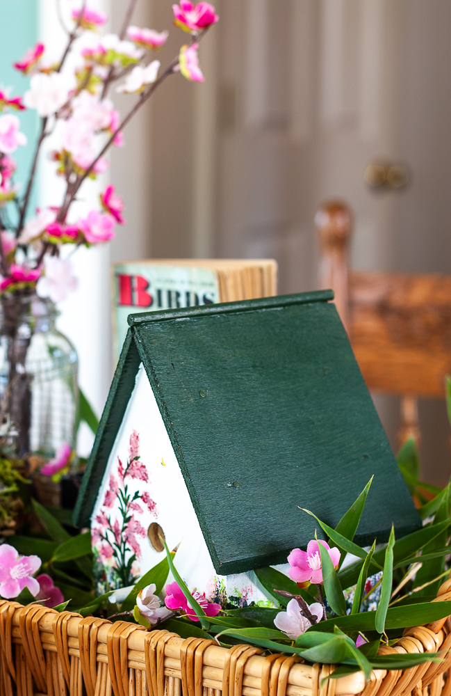 Handmade bird house with a 1949 Birds Golden Nature Guide and pink flowers in a clear, embossed Mason jar