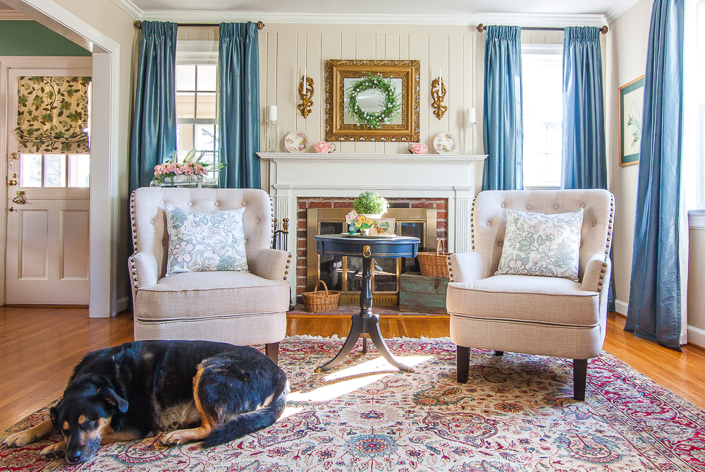 Living room decorated for spring with a dog on the floor