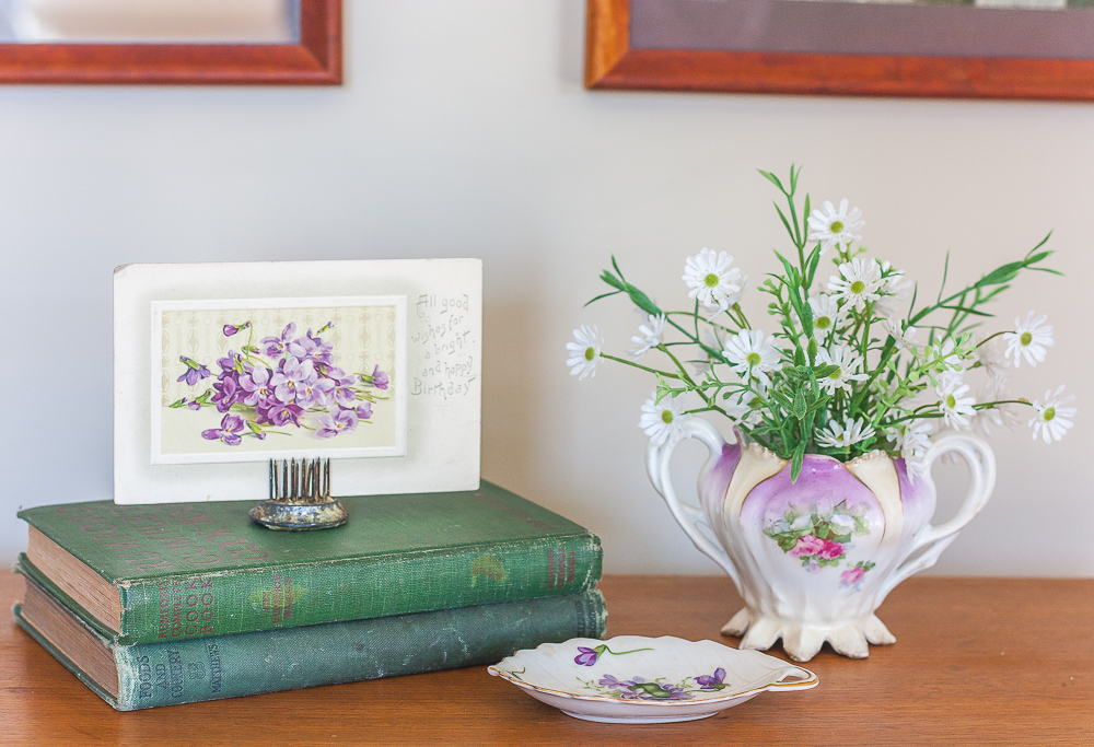 Vintage Rossetti SPRING VIOLETS Occupied Japan Leaf dish 1945-1953 with RS Prussia sugar bowl and two antique books with an antique postcard with violets