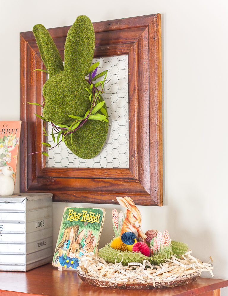 Moss covered rabbit head on a frame backed with chicken wire and other vintage Easter decorations