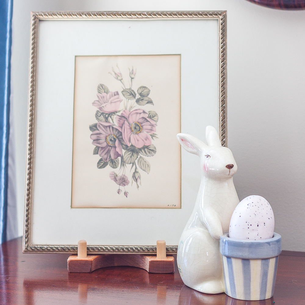 Vintage botanical framed print with an Easter bunny figurine