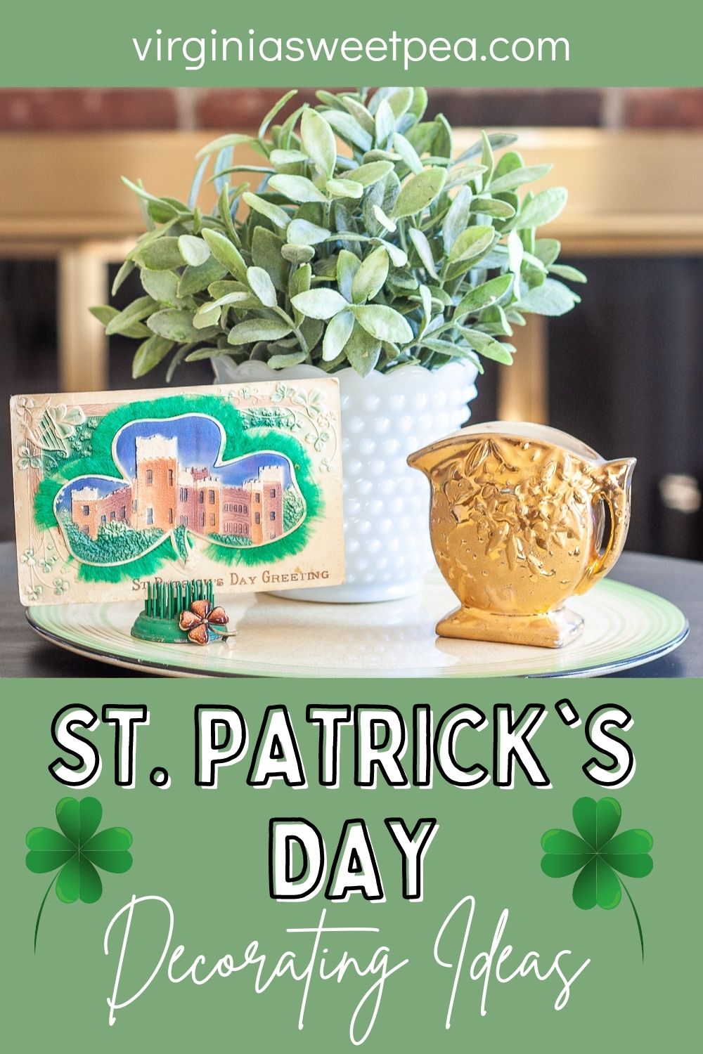 St. Patrick's Day vignette with a vintage postcard, gold pitcher, and a plant in a milk glass vase.