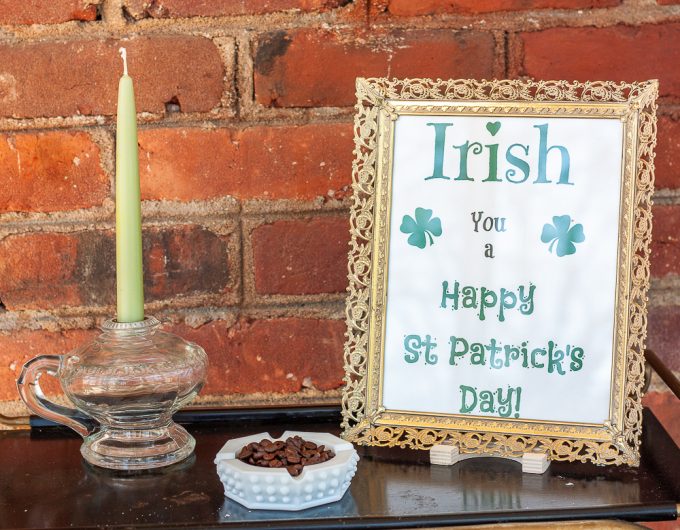 Irish you a happy st. patrick's day free printable, milk glass ashtray filled with coffee beans, antique lamp used as a candle holder