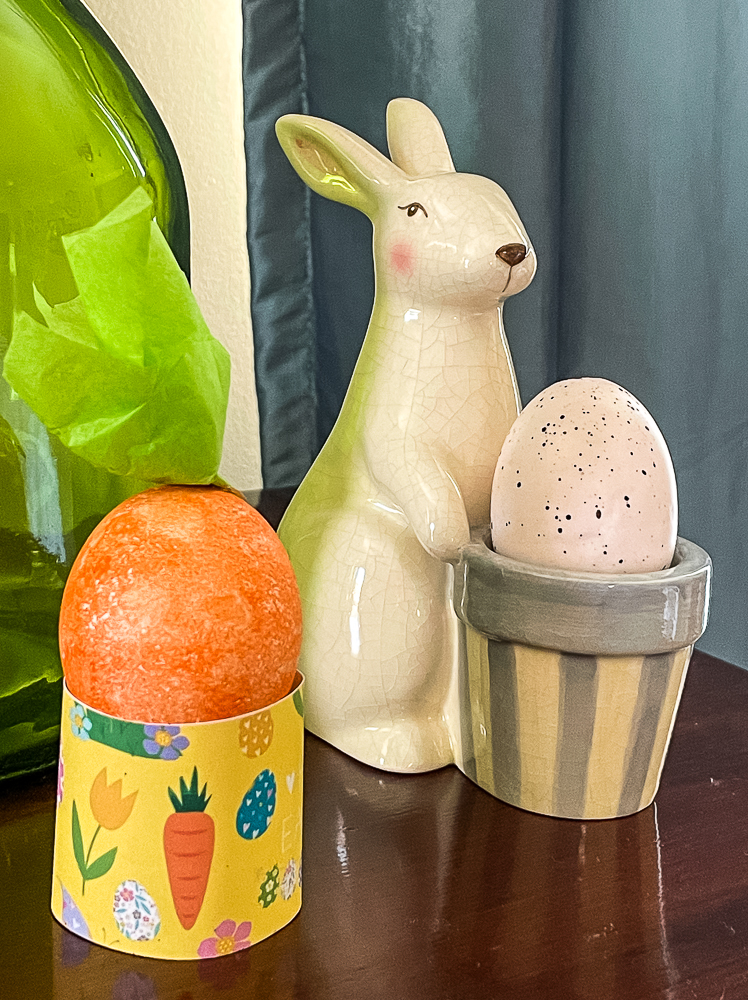 Yellow Free Printable Easter Egg Holder with an Easter Egg Decorated to Look Like a Carrot