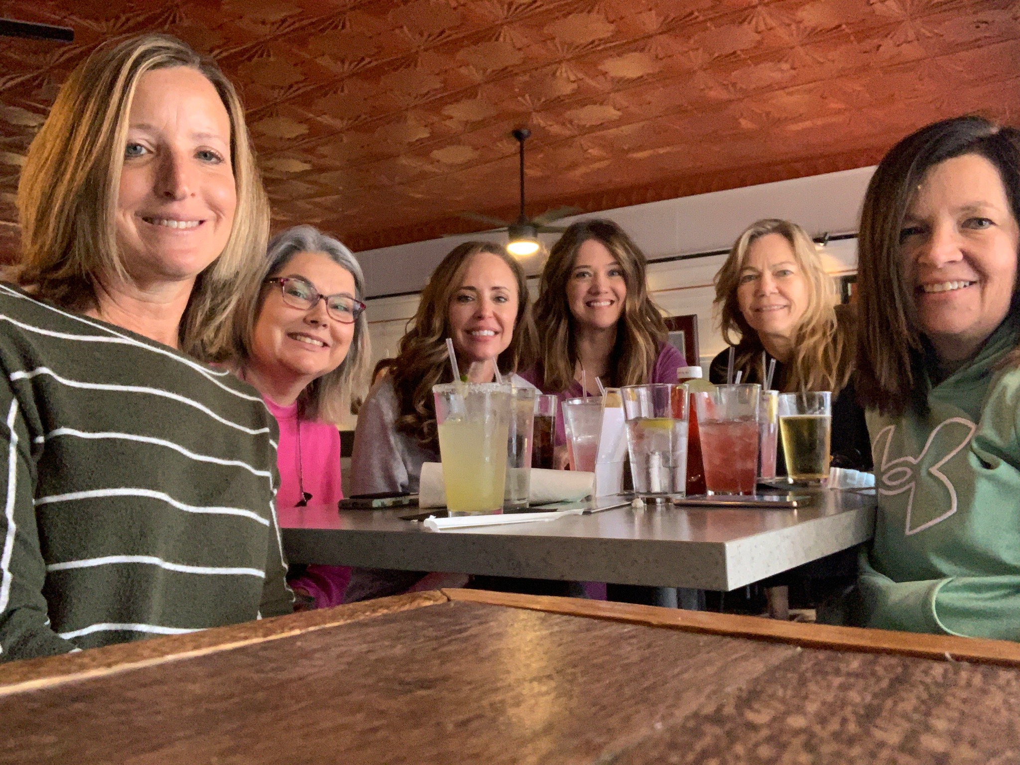 Six women at a table with cocktails in Fredericksburg, VA