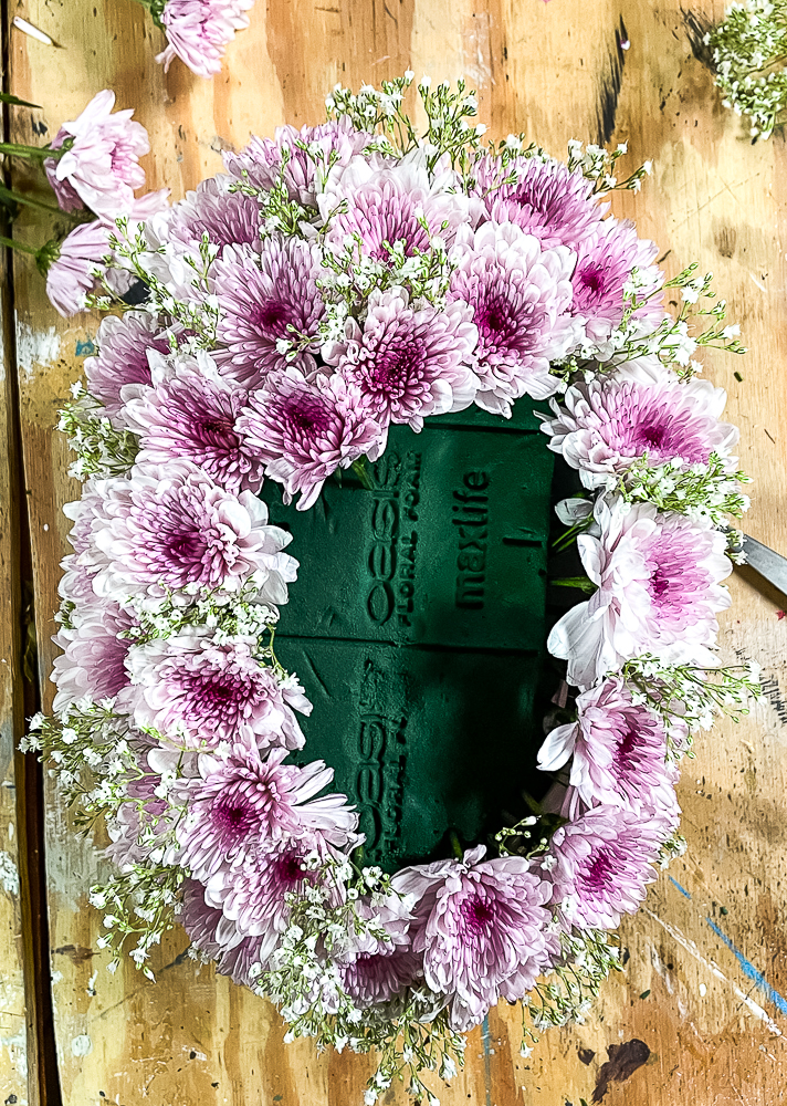 Making a purple Chrysanthemum and Baby's Breath floral arrangement