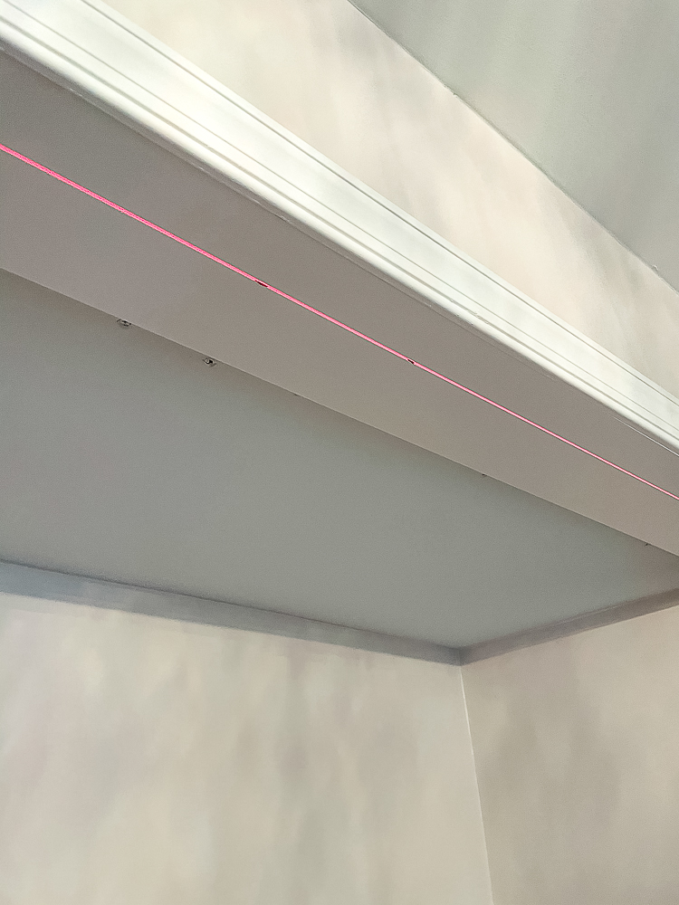 Using a laser level to mark placement of bifold closet door tracks