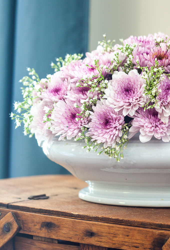 Purple Chrysanthemums and Baby's Breath floral arrangement in an Ironstone bowl