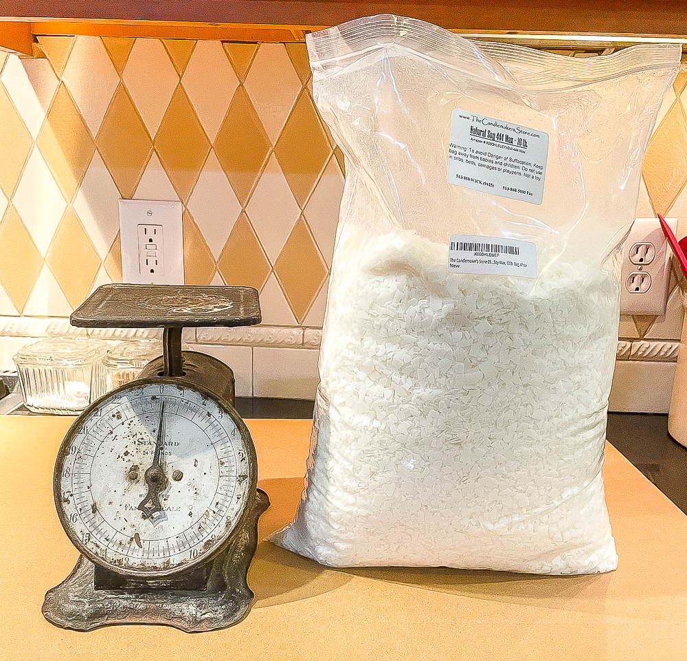 Soy wax in a plastic bag with an antique kitchen scale