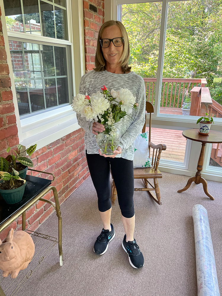 Woman Holding a Peony and Rose Flower Arrangement