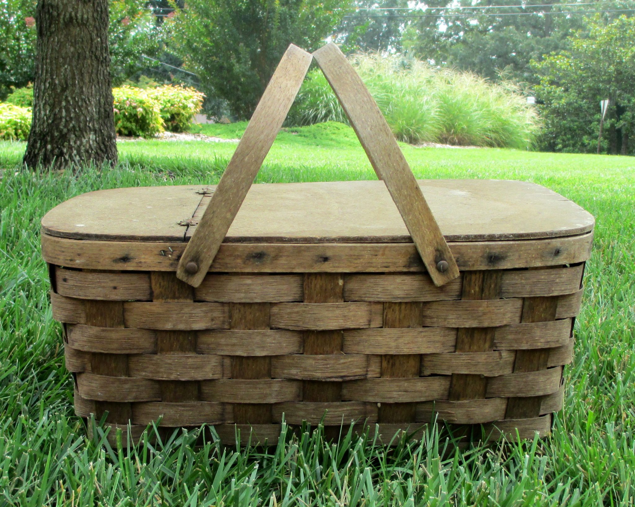 Dirty inside of a picnic basket found in a trash pile