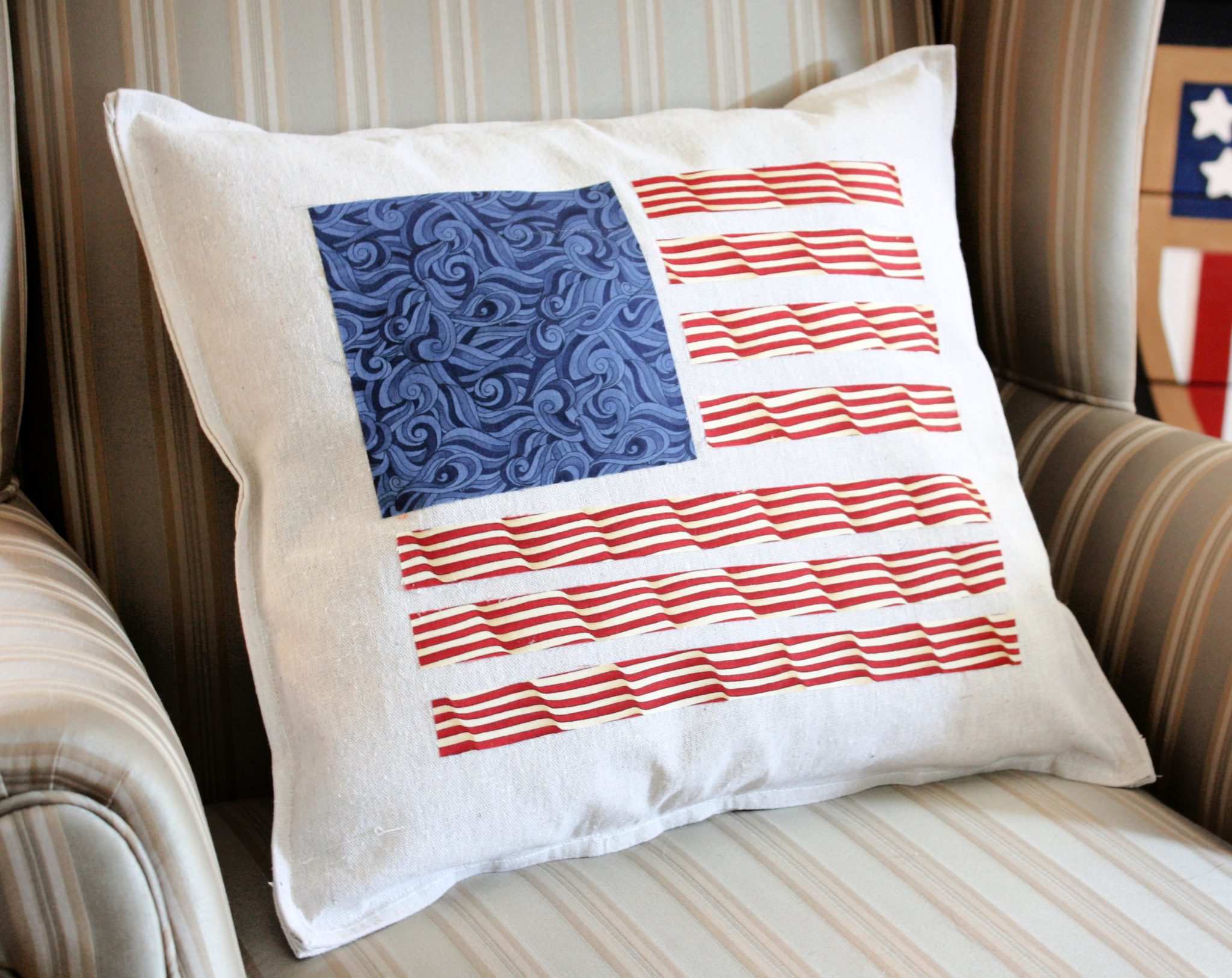 American flag pillow made with strips of fabric.