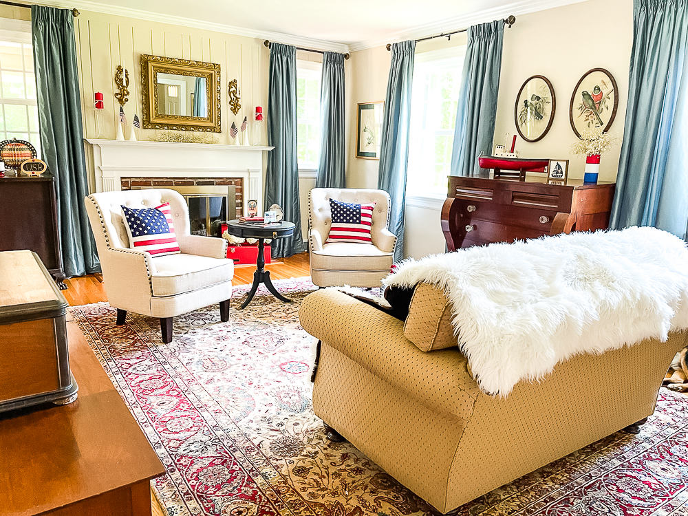 Living room and mantel decorated patriotically with vintage.