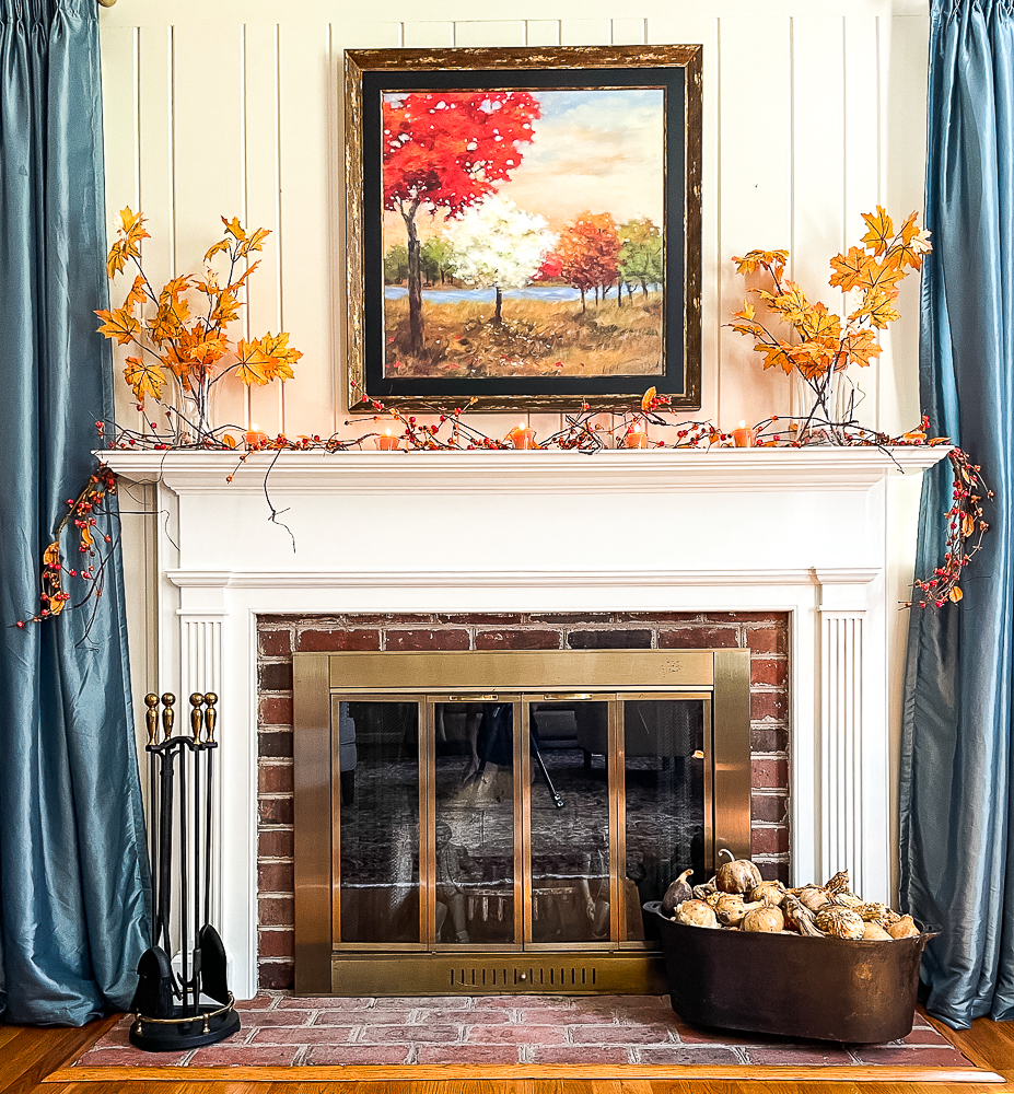 Fall mantel decorated in traditional fall colors