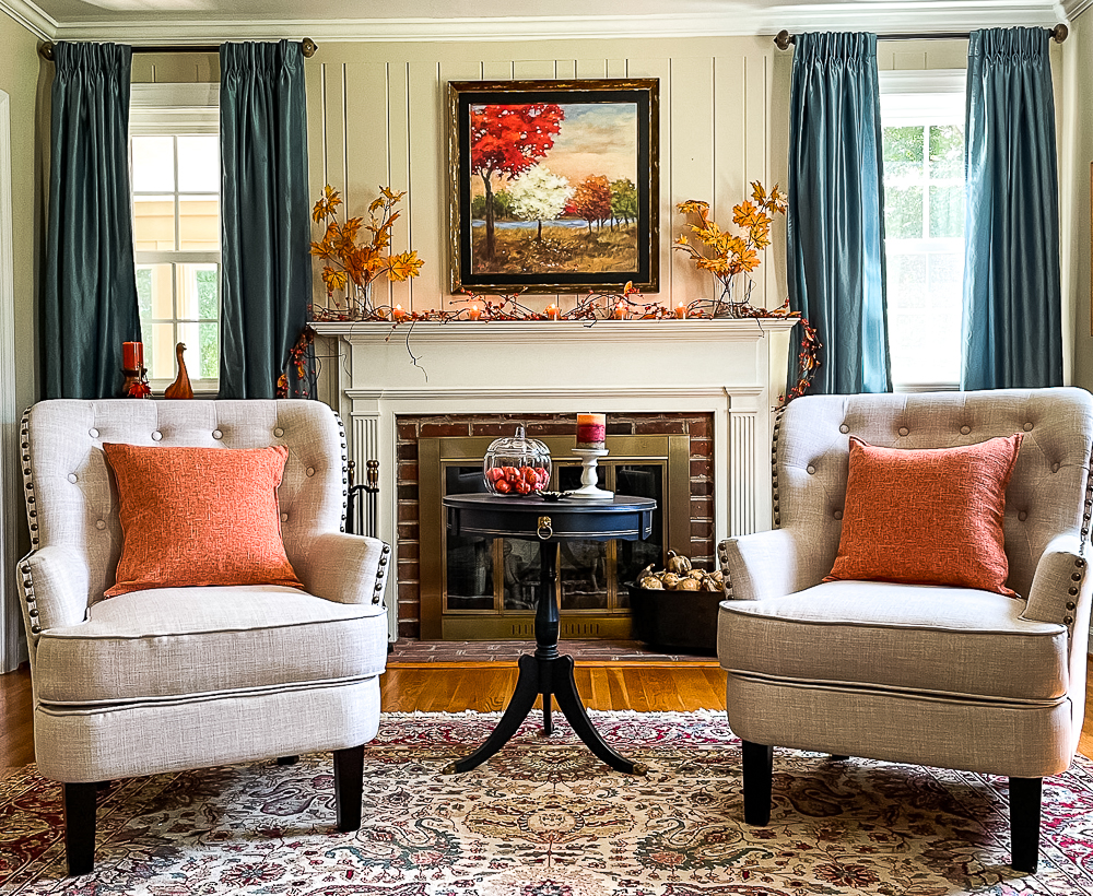 Fall mantel decorated in traditional fall colors