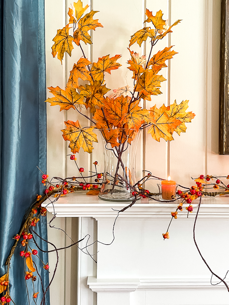 Fall mantel decorated in traditional fall colors