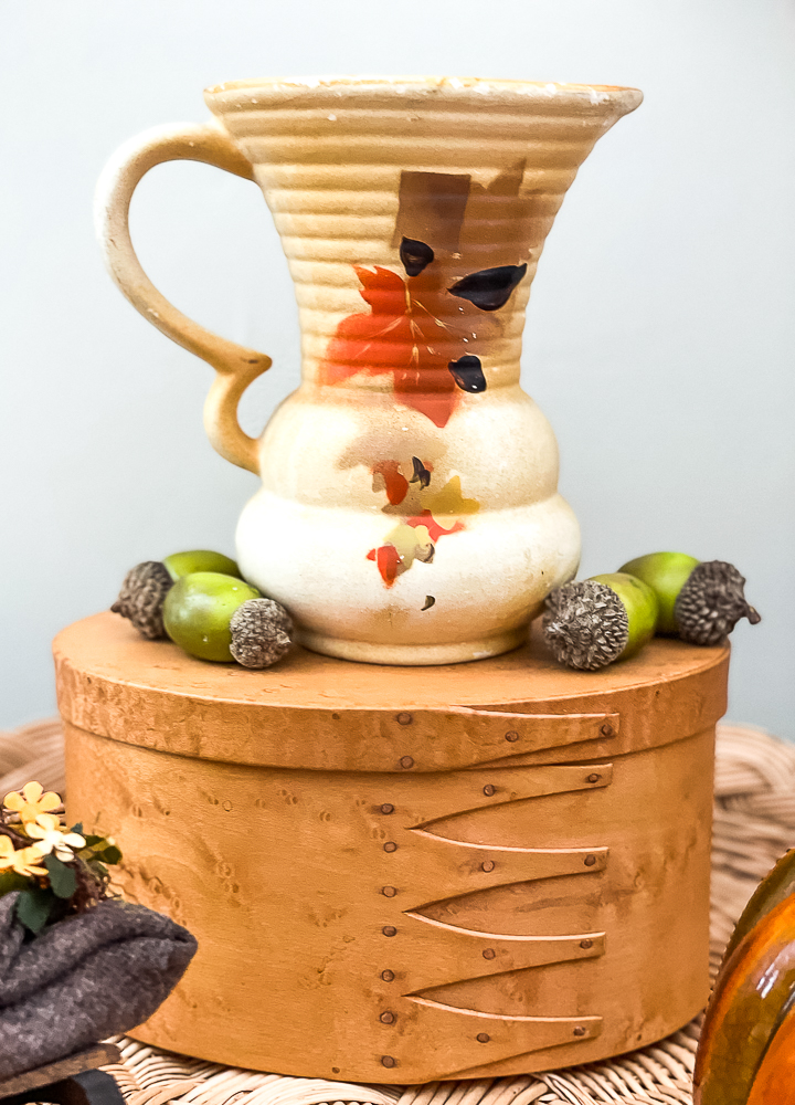 Vintage Czech pottery vase on a maple box with acorns