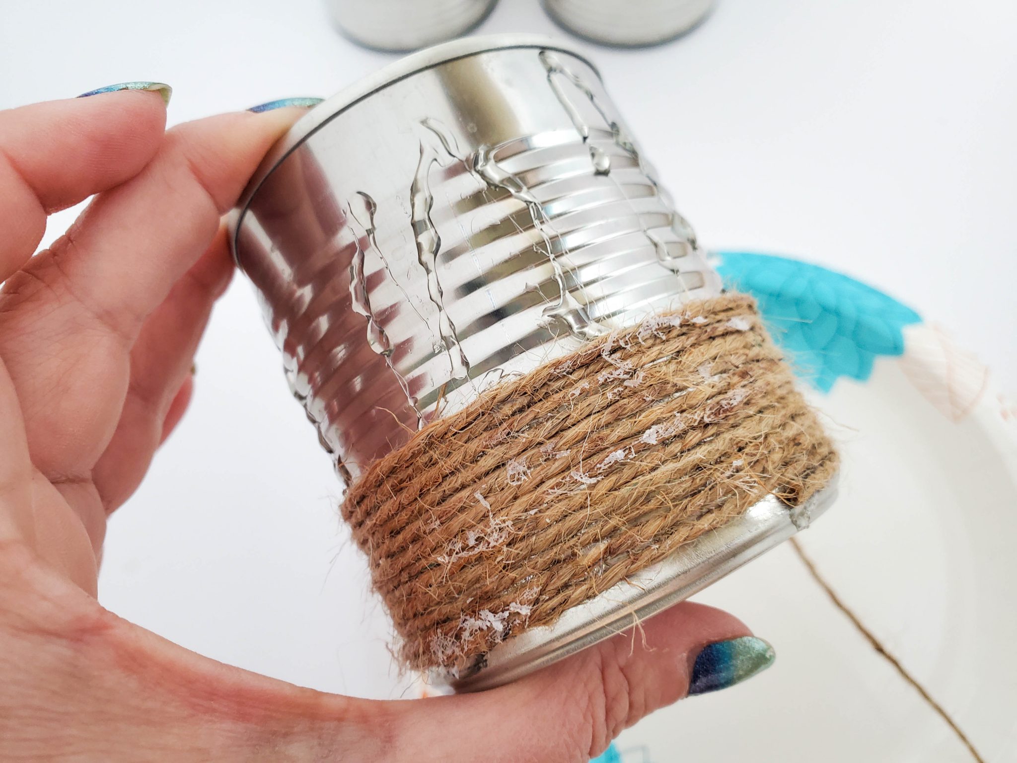 Gluing twine to a can