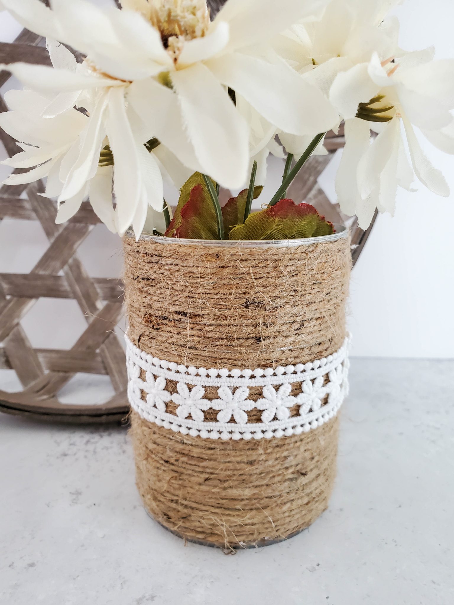 Upcycled can decorated with twine and lace