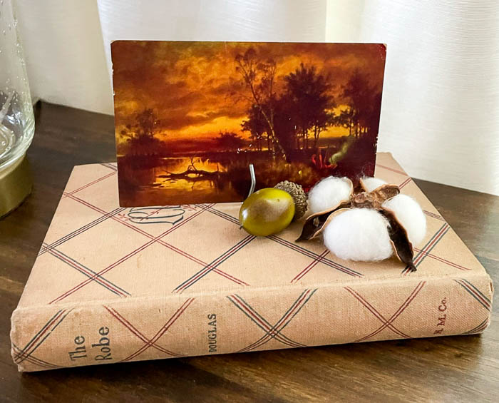 Vintage fall postcard, book cotton boll, and acorn