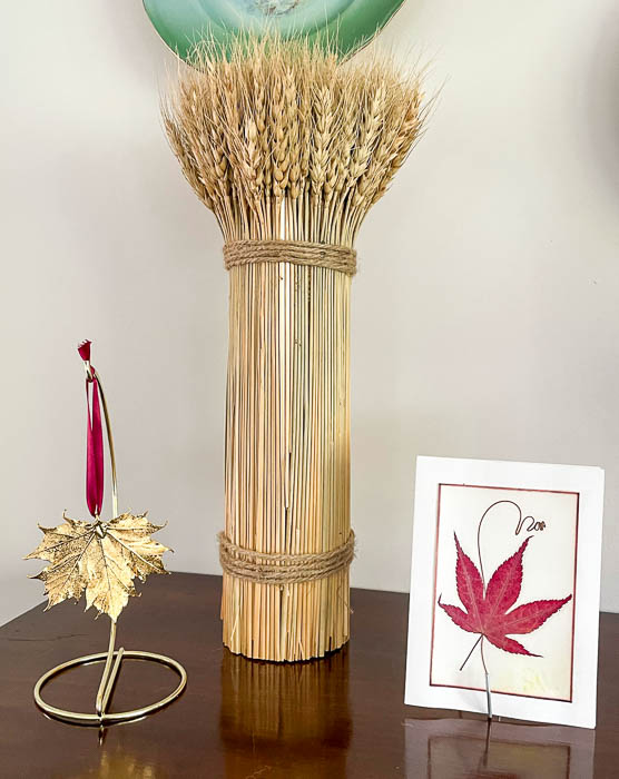 Wheat sheave, gold maple leaf ornament, pressed maple leaf