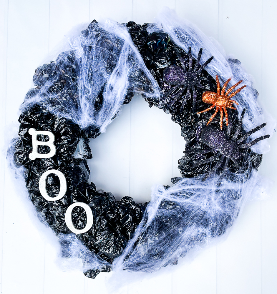 Step-by-step tutorial to make an upcycled plastic bag Halloween wreath