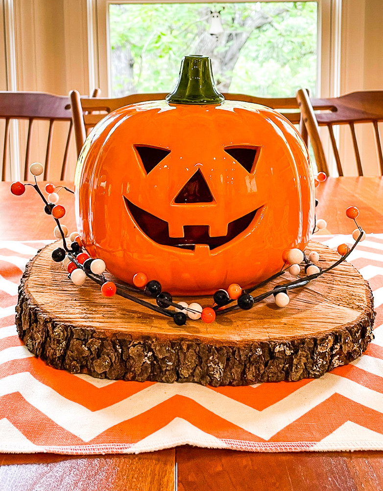 Jack-o-Lantern displayed on a wood slice