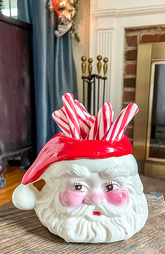 Antique Santa mug filled with peppermint sticks