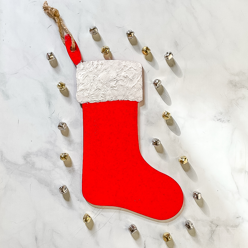Painted Christmas Stocking Surrounded by Jingle Bells