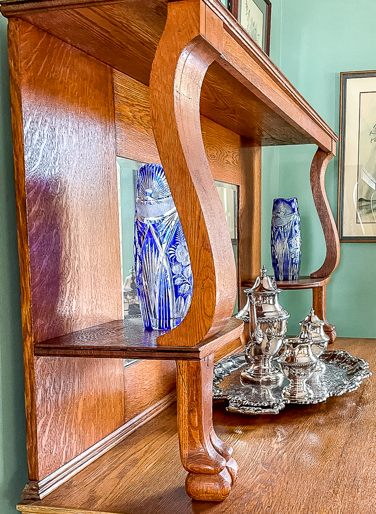 Czechoslovakian blue vases on a oak buffet