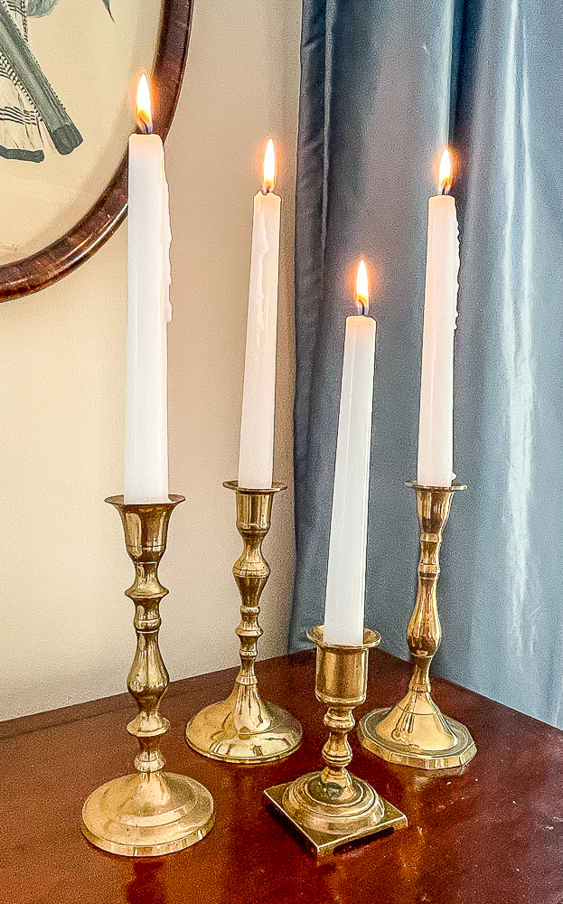 Brass candle holders with white candles
